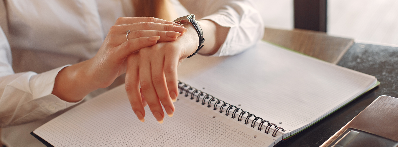 Business person checking their watch